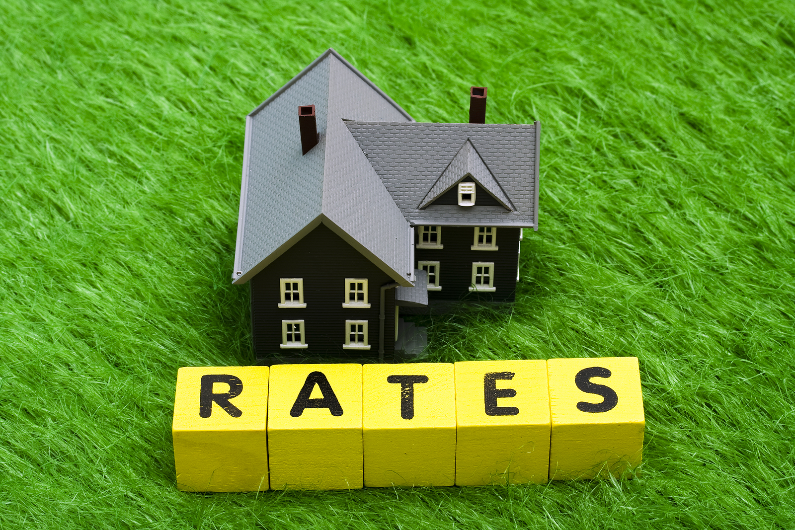 House with alphabet blocks spelling rates - mortgage rates
