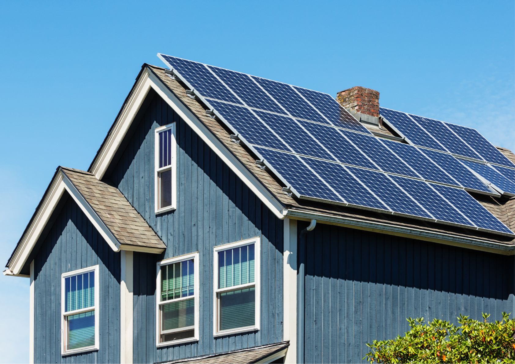 Home solar panels on a pitched roof.