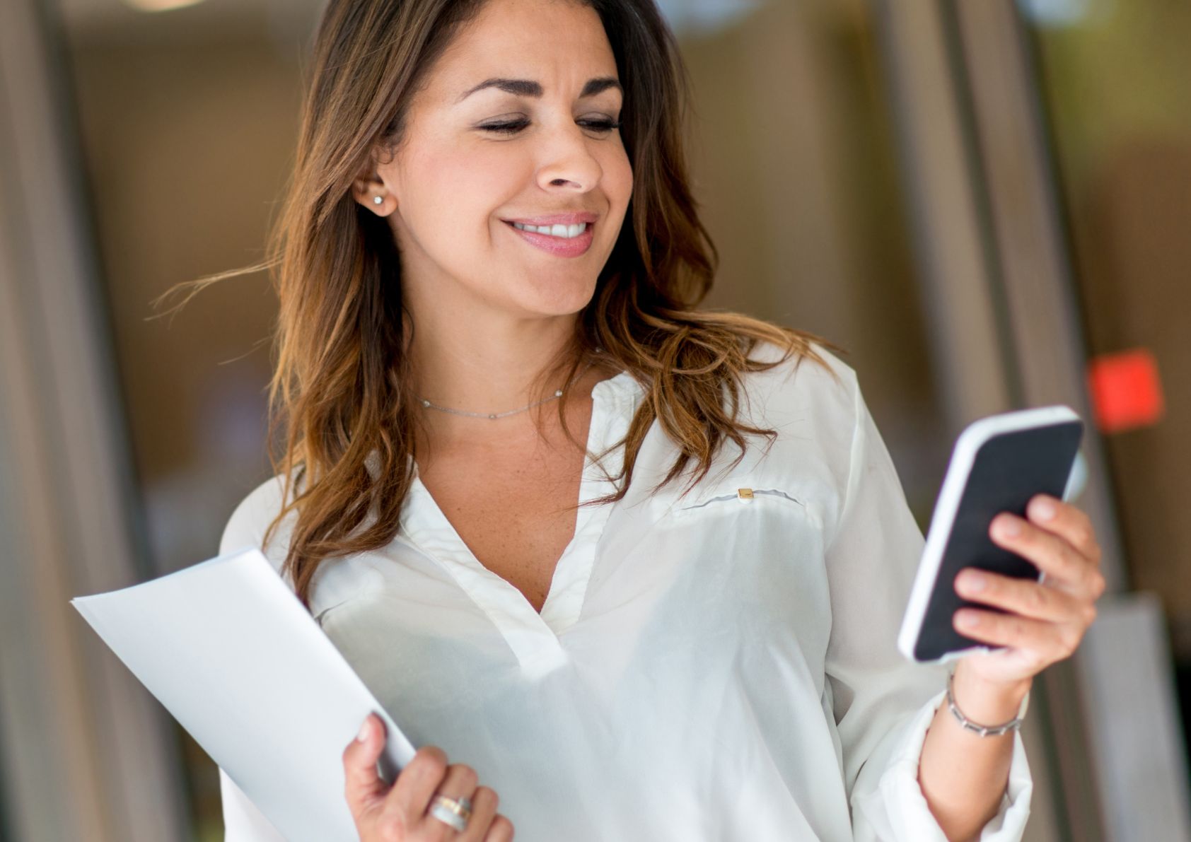 A female real estate agent looking over current inventory in her MLS. 