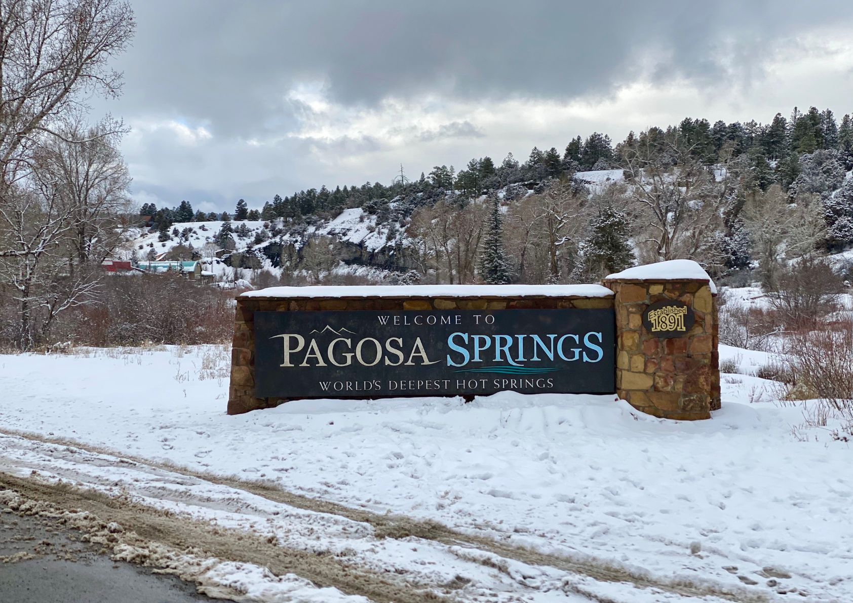 Welcome to Pagosa springs Colorado sign surrounded in snow. 